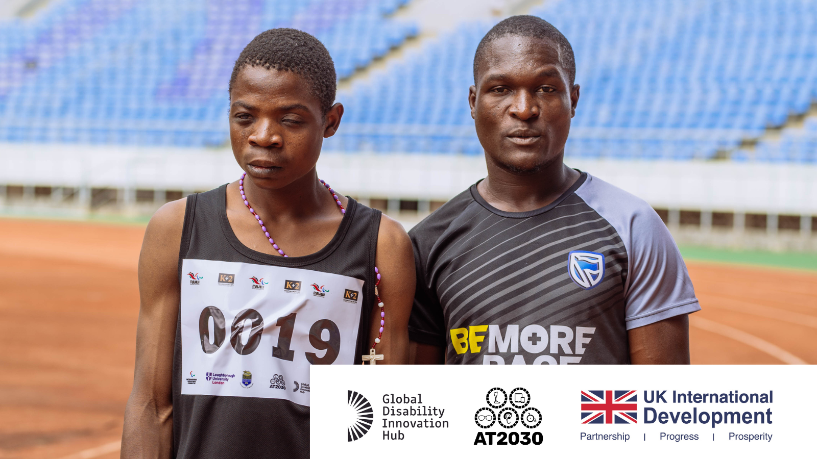 Two runners are looking into the camera. One is visually impaired Cover Image
