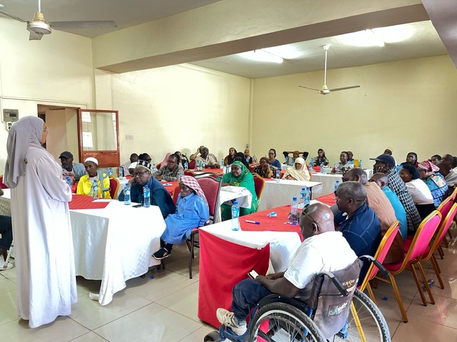 Image of OPD workshop with large round tables and discussions among a diverse audience Cover Image
