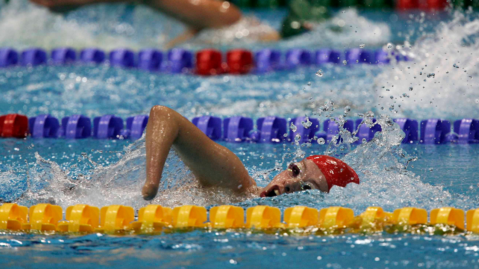 Paralympic swimmer racing Cover Image