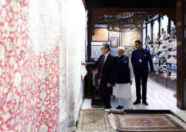 Mumbai, India. Prime Minister Keir Starmer and Indian Prime Minister Narendra Modi look at carpets while arriving at JioWorld Fintech conference at the Bandra Kurla Complex. Picture by Simon Dawson / No 10 Downing Street Cover Image
