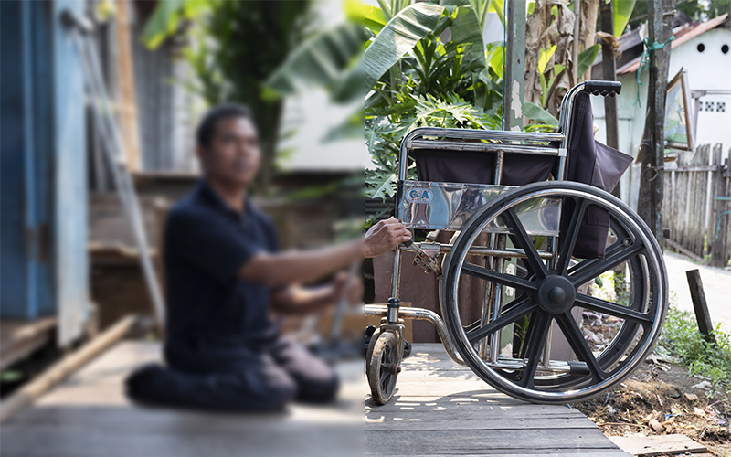 Man sitting on his front porch alongside his wheelchair Cover Image