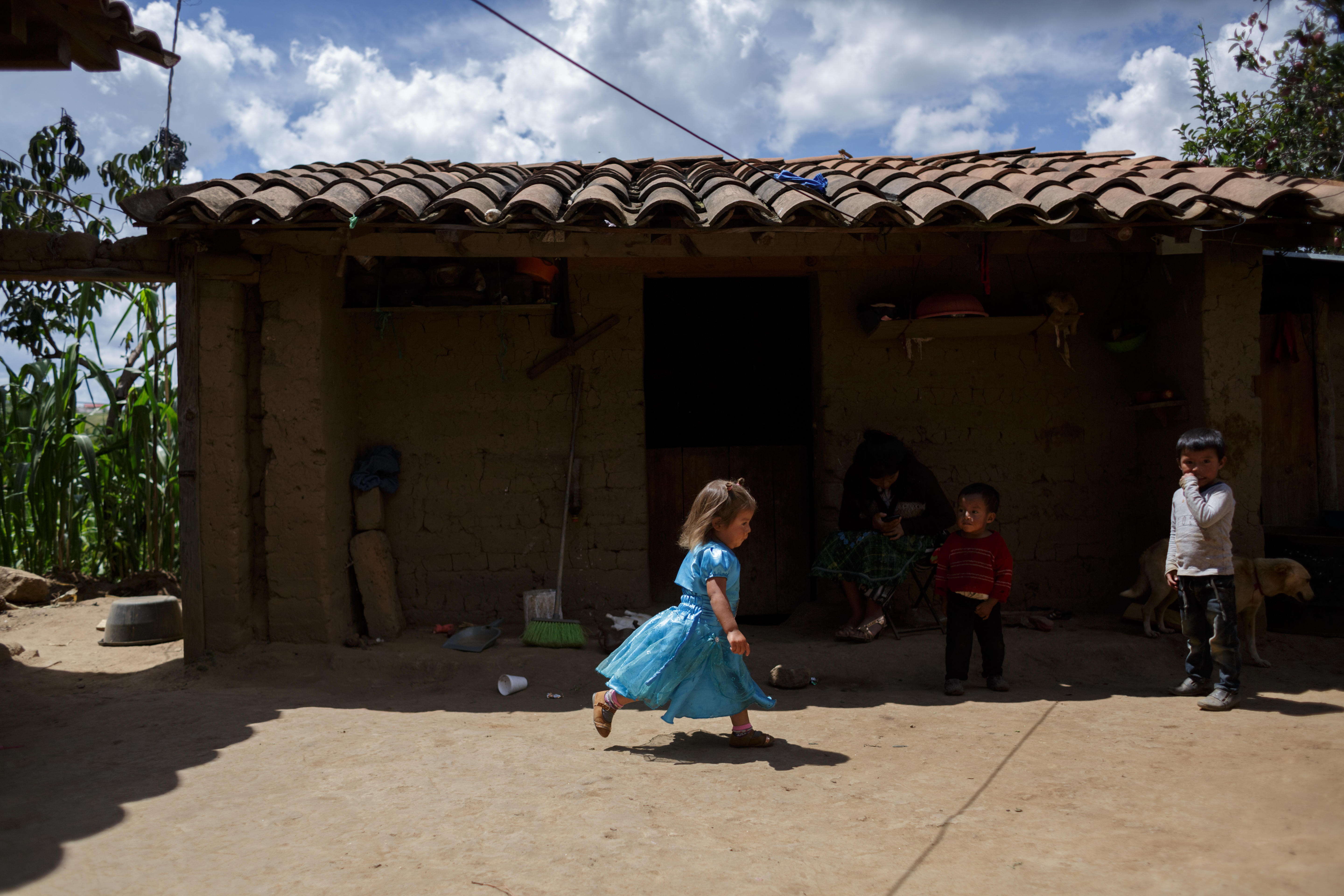 Children standing outside an informal dwelling