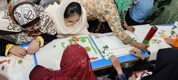 A group of participants using arts and crafts materials to create their stories