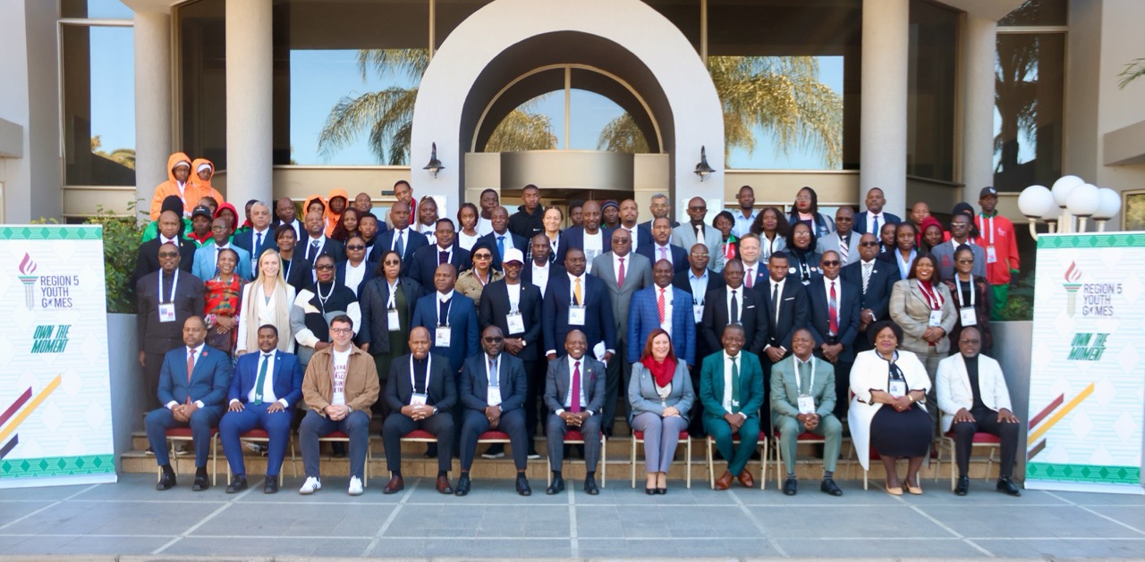 A large group of delegates pose for a group photo outside a building at the Region 5 Youth Games in Windhoek.