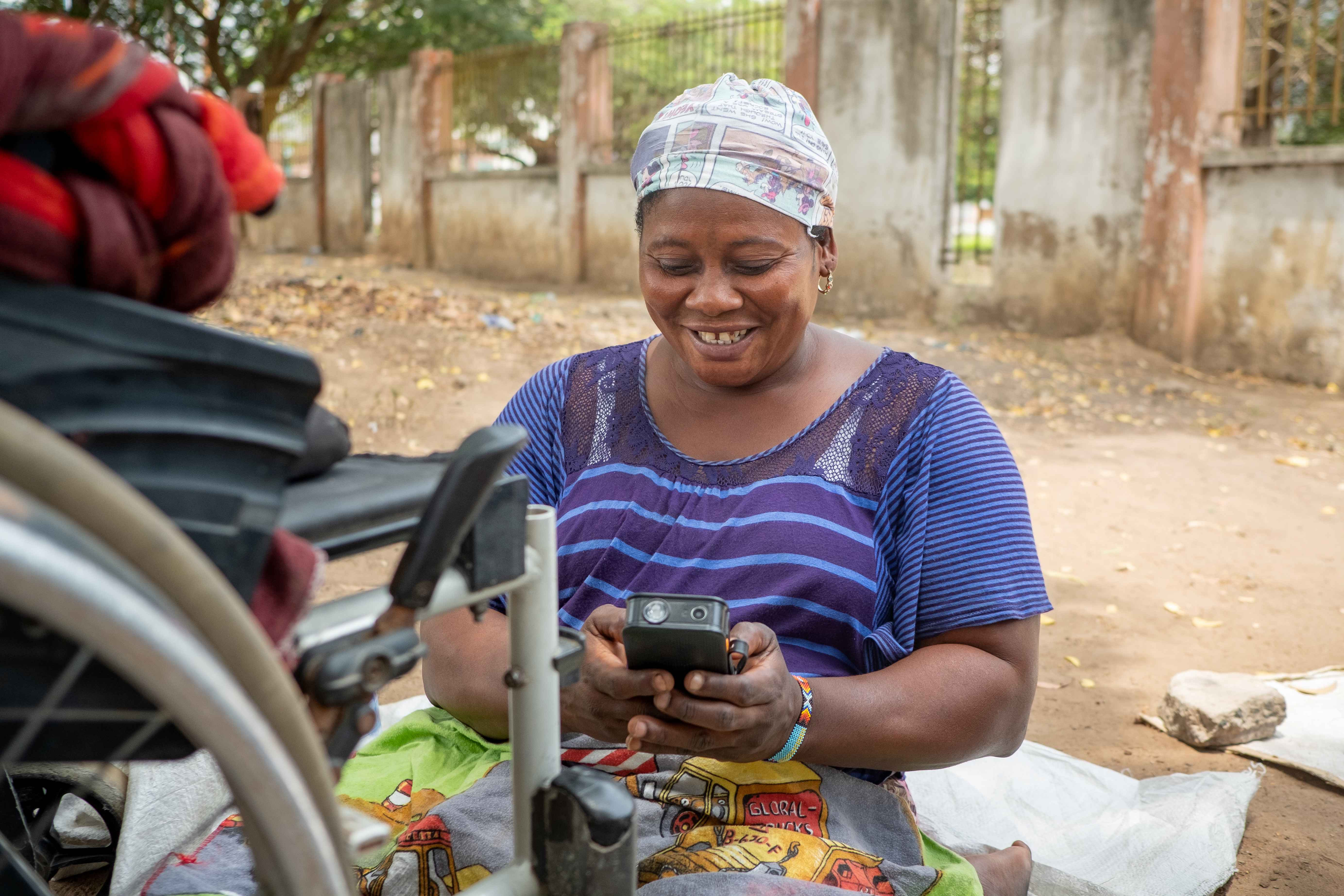 Ghana women warmly engaging with mobile 