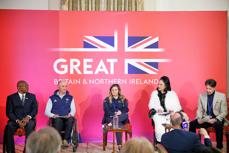 Panel in discussion with 5 panelists