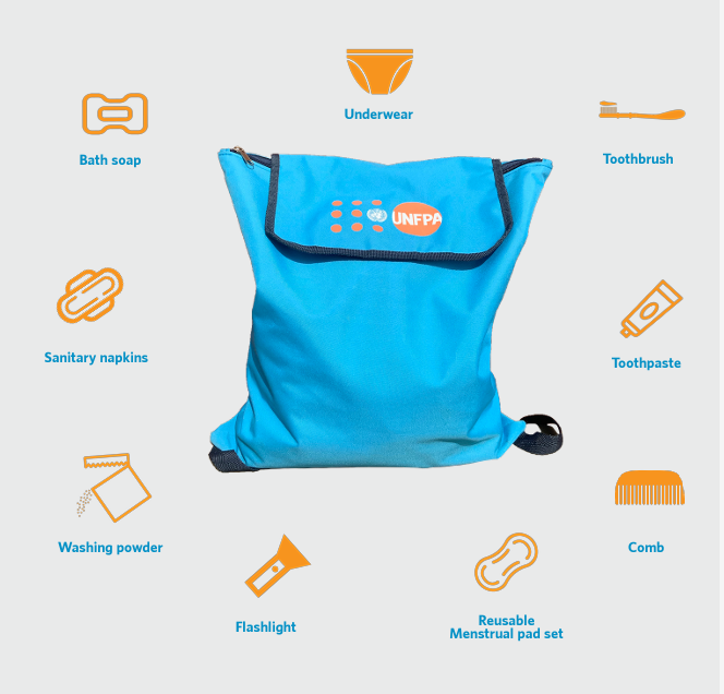 A blue bag with an UNFPA logo. There are images in orange of items in the kit, such as soap, toothrbush, comb, reusable pads with labels in white text