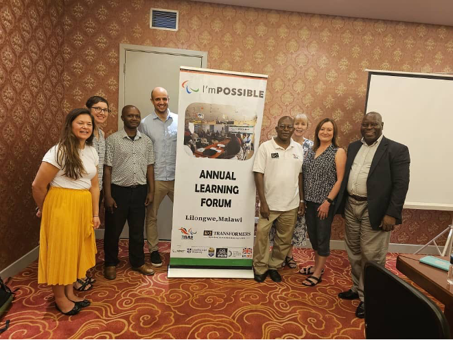 Jennie, Jessica, Josef, Michael, James, Diane, Anne and Mufunanji at a meeting with I'mPossible during the knowledge Exchange Forum