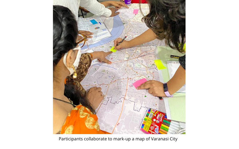 people at a workshop planning on a map