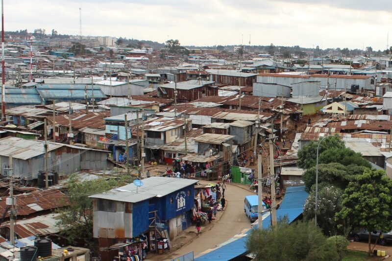 A photo of a slum area that is highly populated with houses