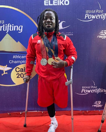 Emmanuel Nii Tettey Oku with his medals at the World Para Powerlifting event in Cairo, 2022. 