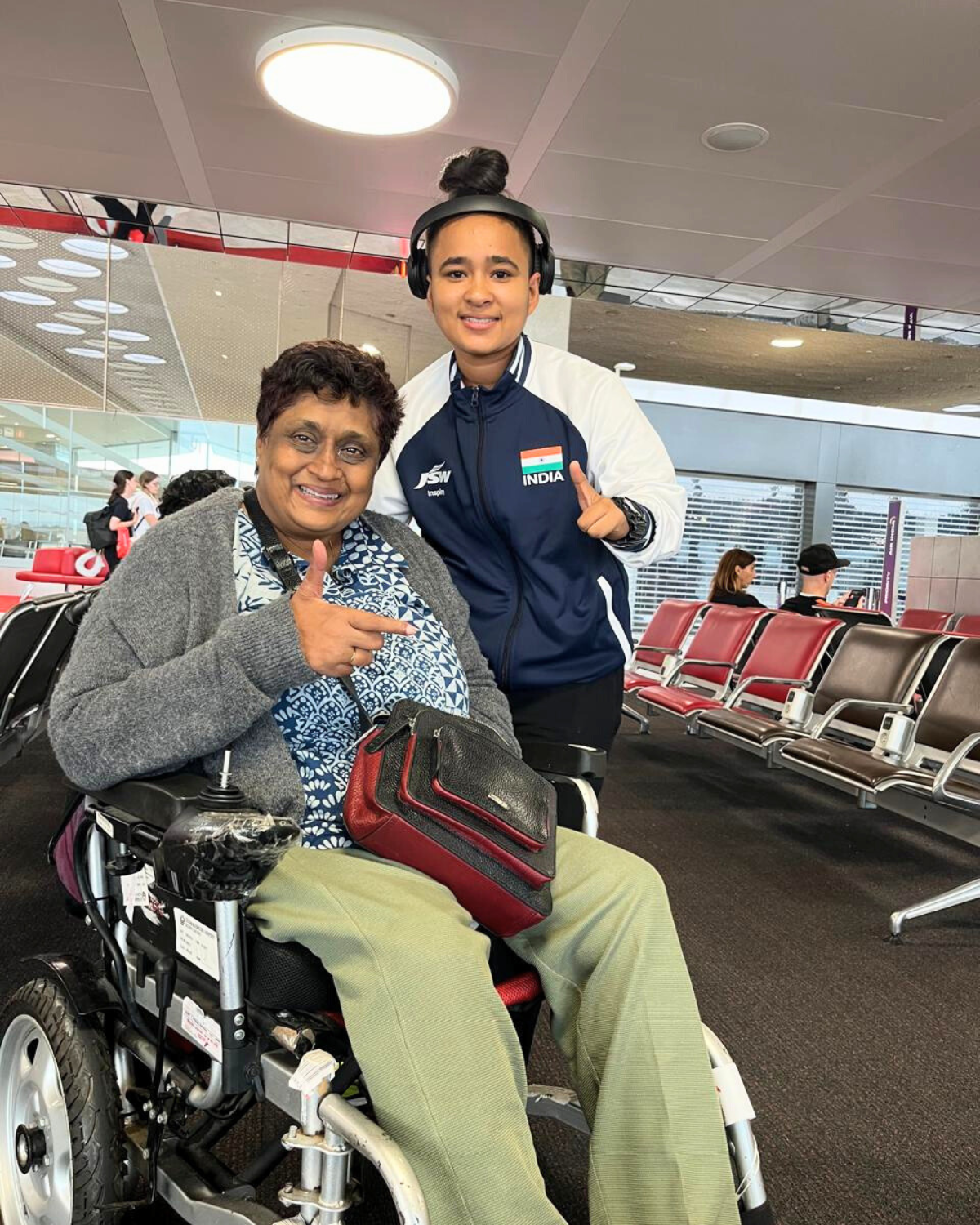 Shivani with Paralympian Aruna Tanvar smiling at the camera and giving a thumbs up Cover Image