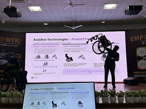 Thryve Mobility demonstrate the lightness of their wheelchair - holding the wheelchair up on stage while presenting during Empower conference Cover Image